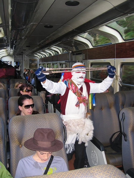 0806120001.JPG - Day 6, Thursday, June 12.  Dancer aboard the train through the Sacred Valley from Agua Caliente to Ollantaytambo.